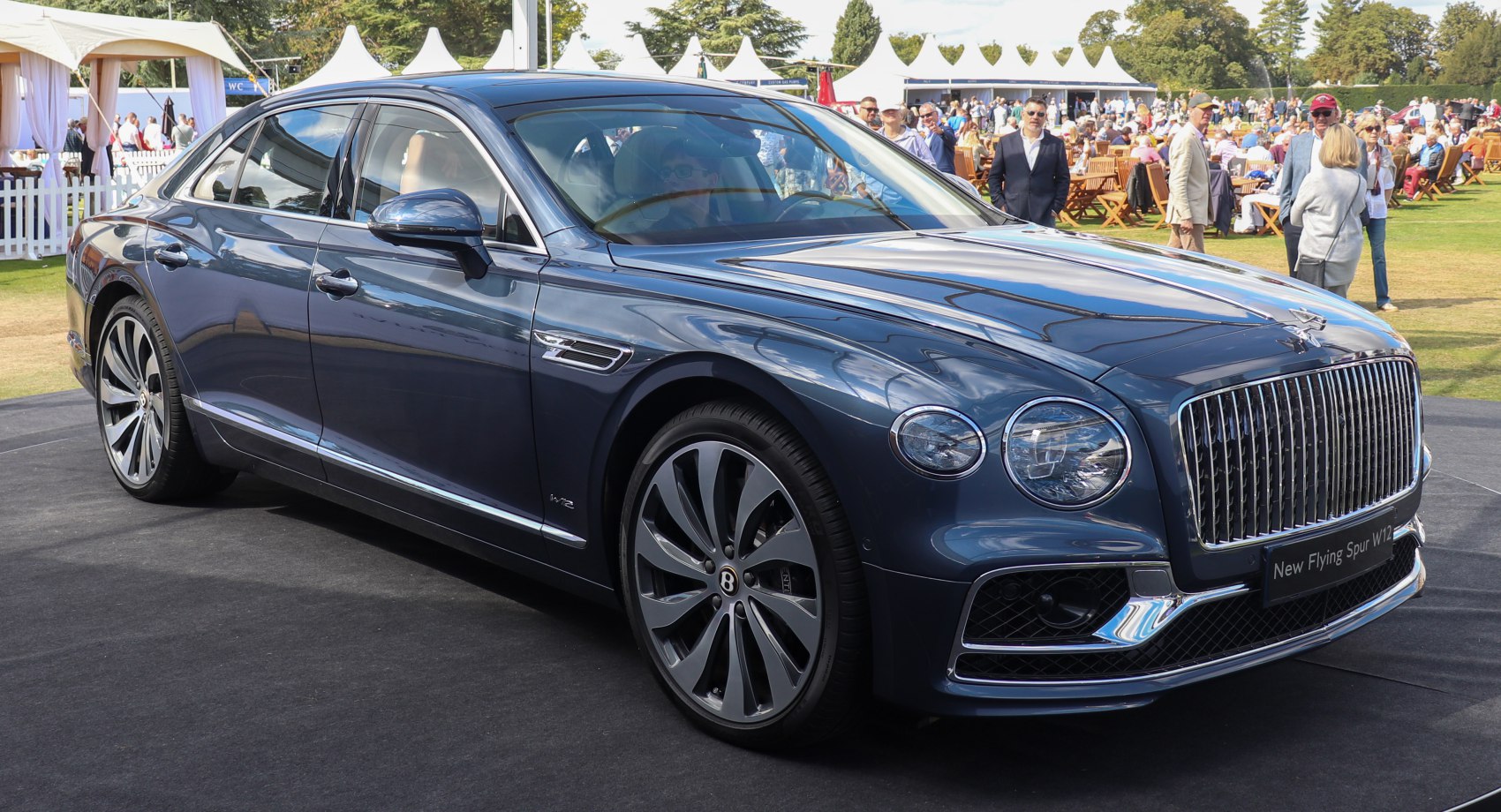 Luxury sedan with prominent chrome grille and stylish alloy wheels
