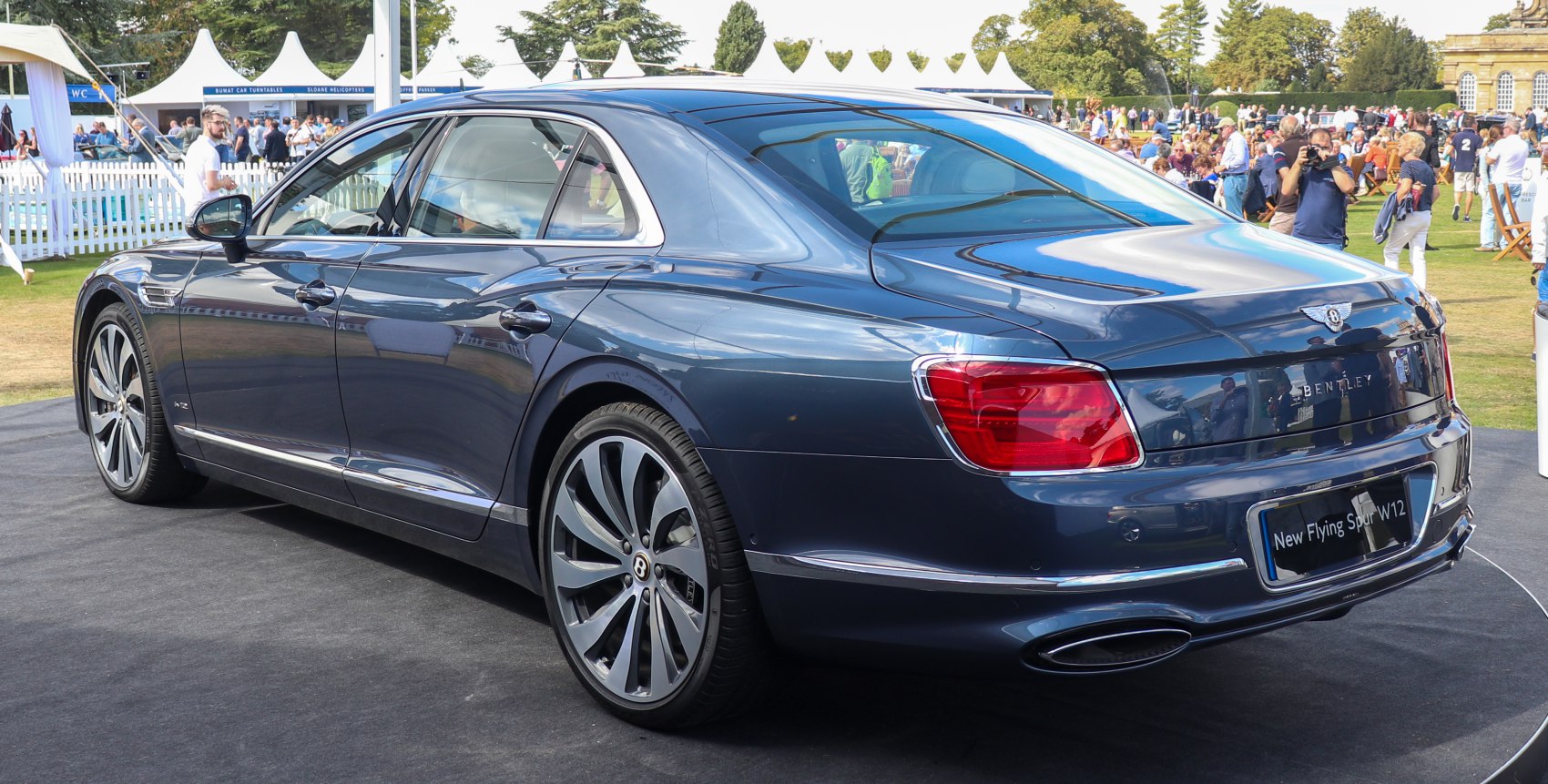 Rear and side view of a luxury sedan with alloy wheels and signature taillights