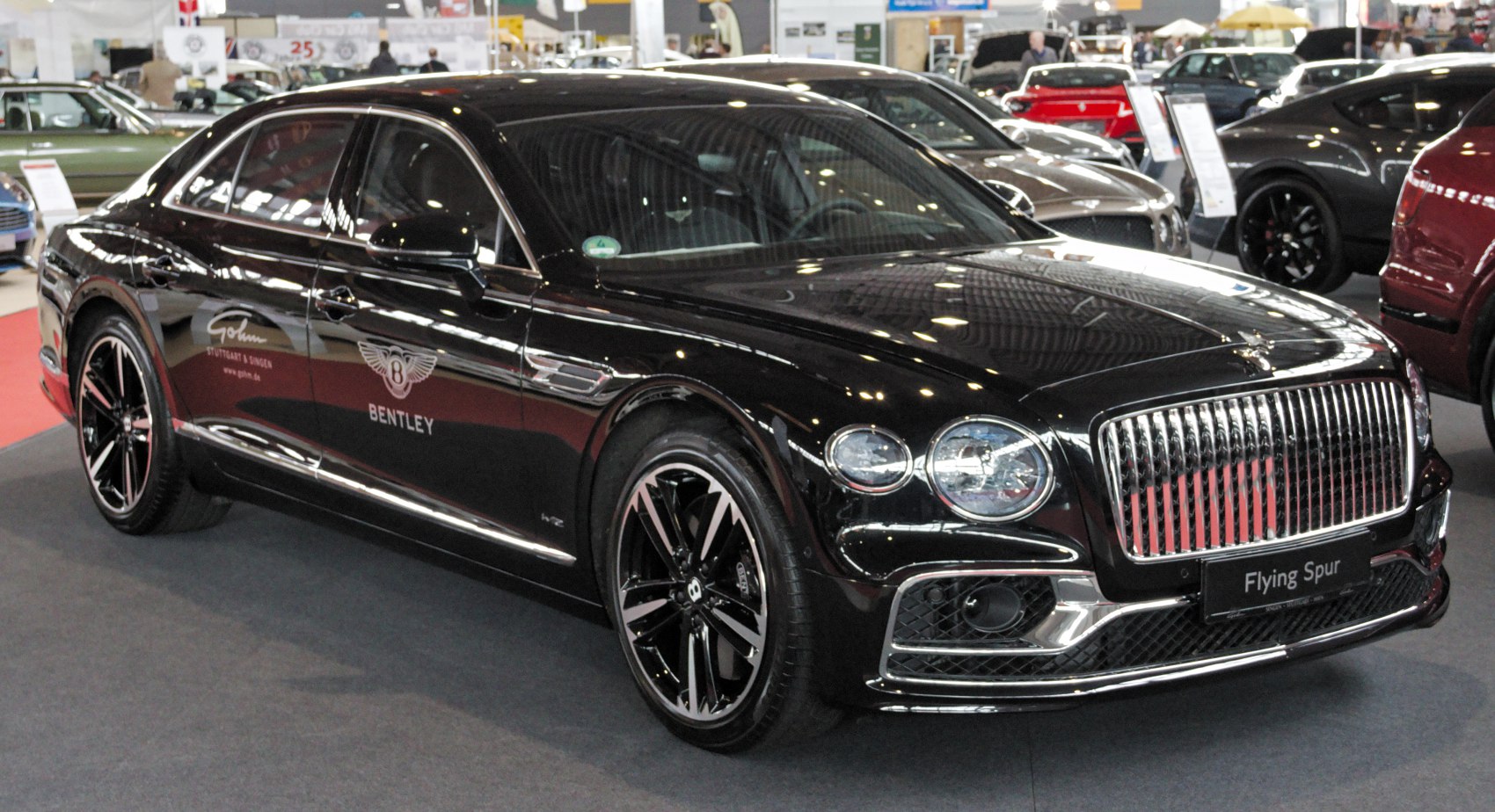 Luxury sedan with prominent chrome grille and stylish alloy wheels