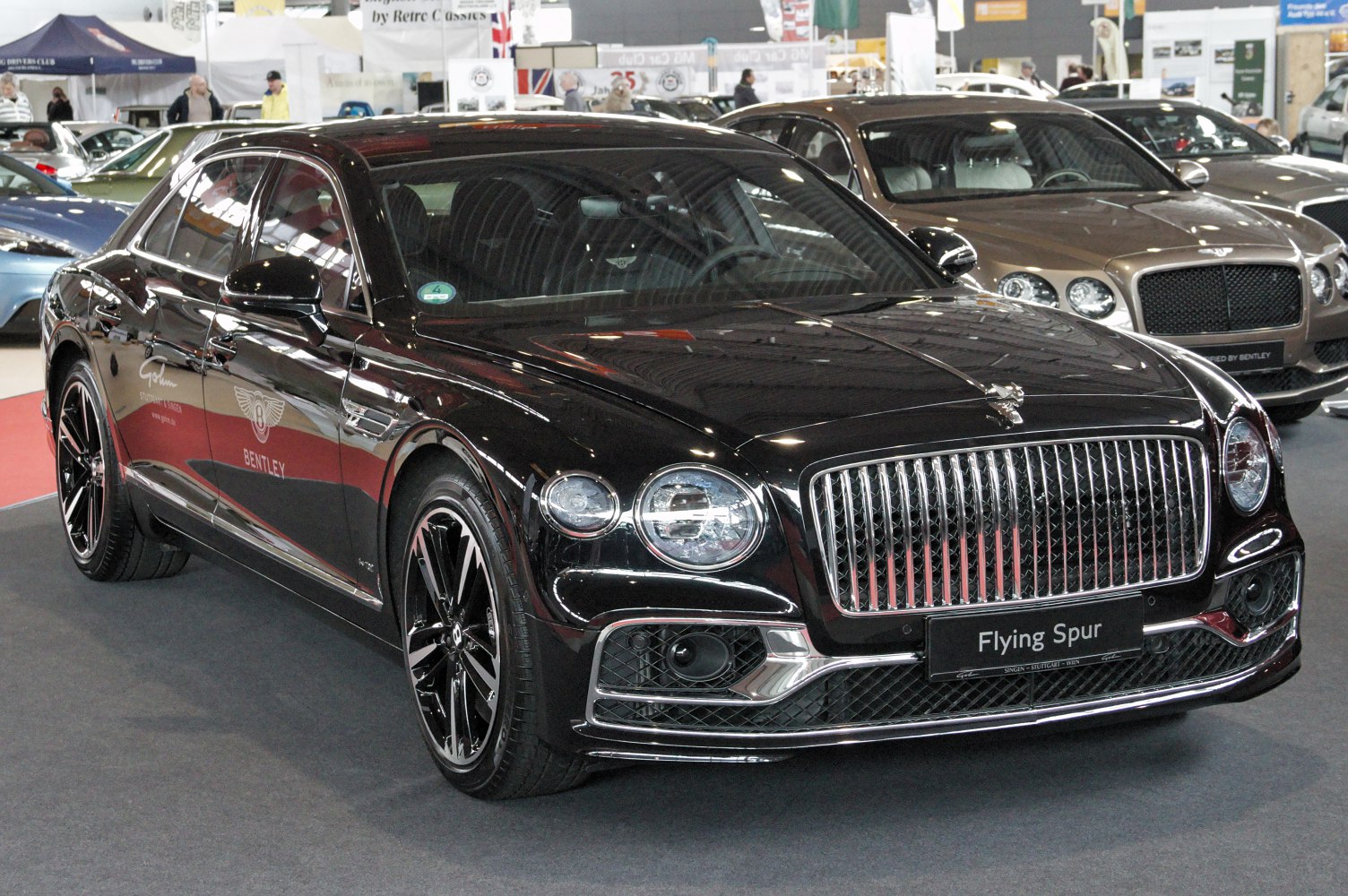 Bentley luxury sedan front view with chrome grille and LED headlights
