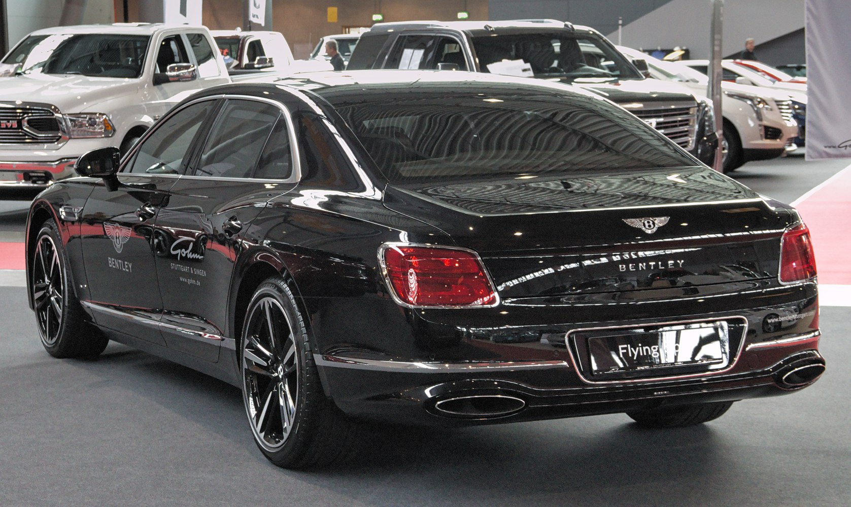 Rear view of luxury sedan showing taillights and dual exhausts