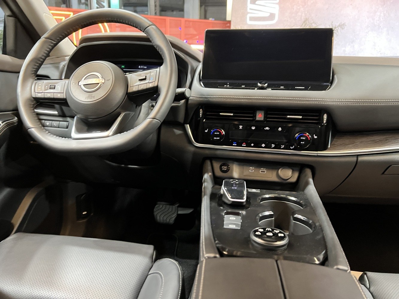 Modern car interior with digital display and multi-function steering wheel