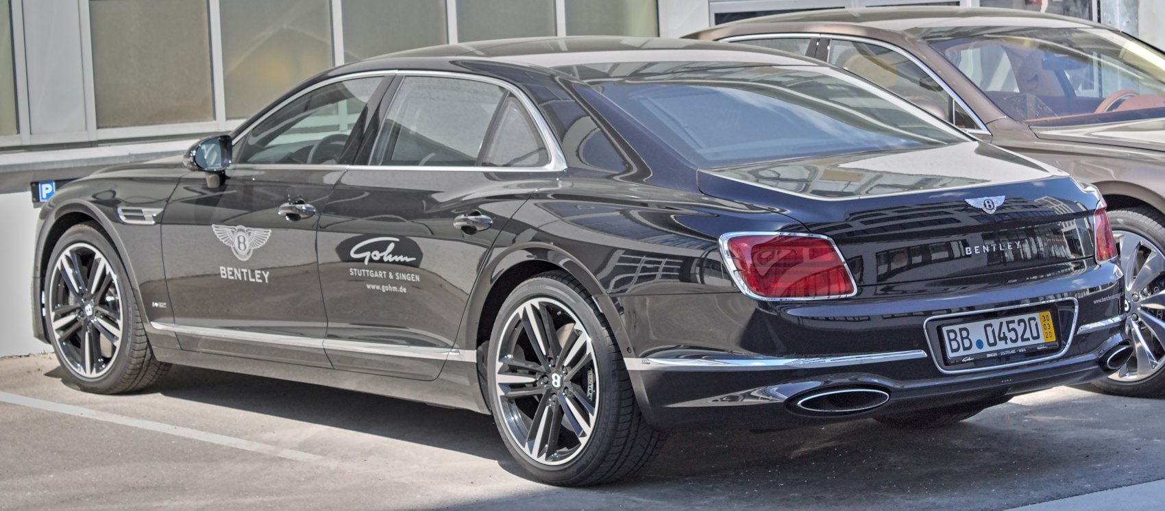 Rear side view with tail lights and dual exhausts