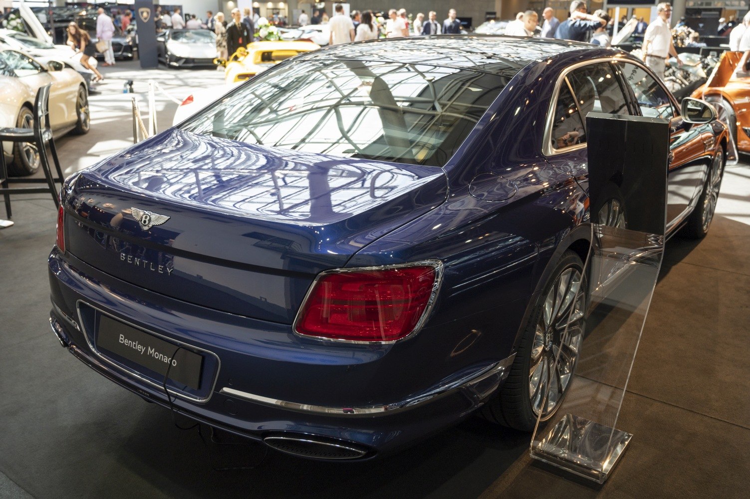 Luxury sedan rear with distinctive taillights and chrome accents