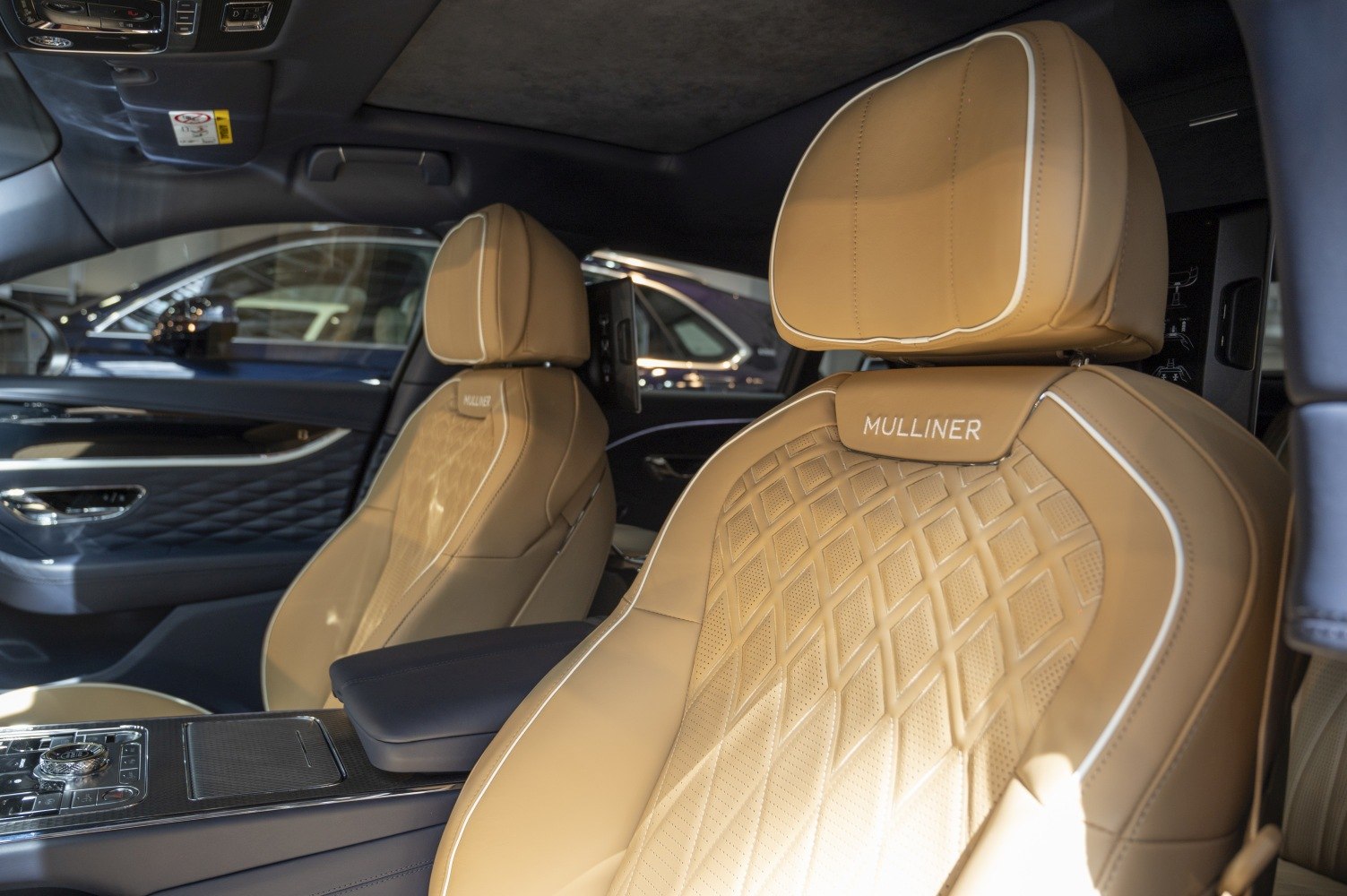 Tan leather Mulliner seats with diamond stitch pattern in luxury vehicle interior