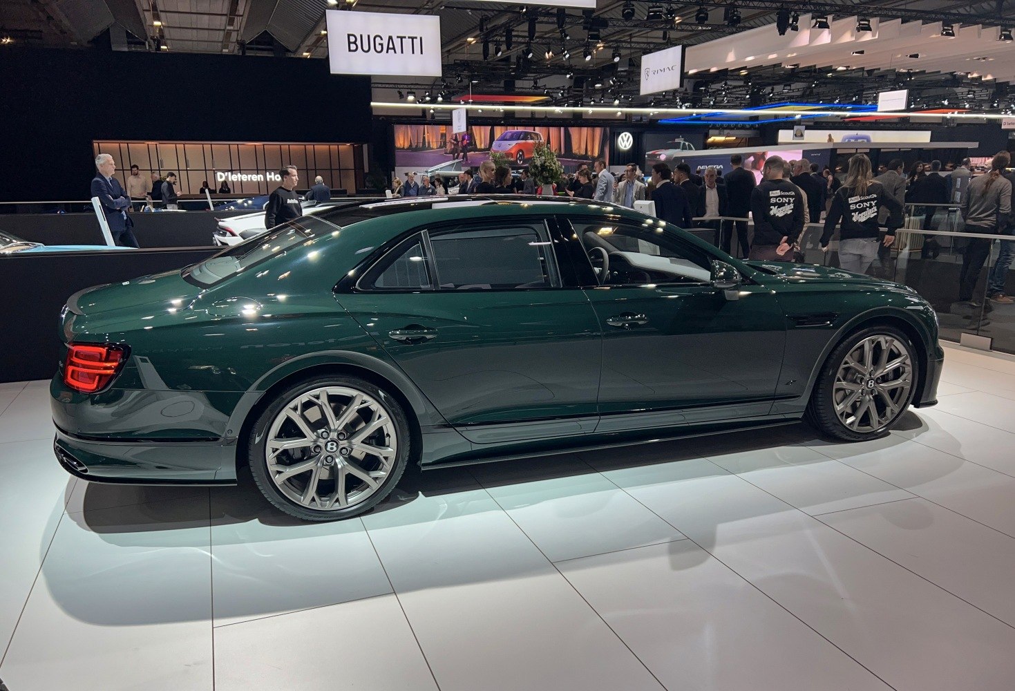 Side profile of a luxury sedan with prominent alloy wheels and sleek design