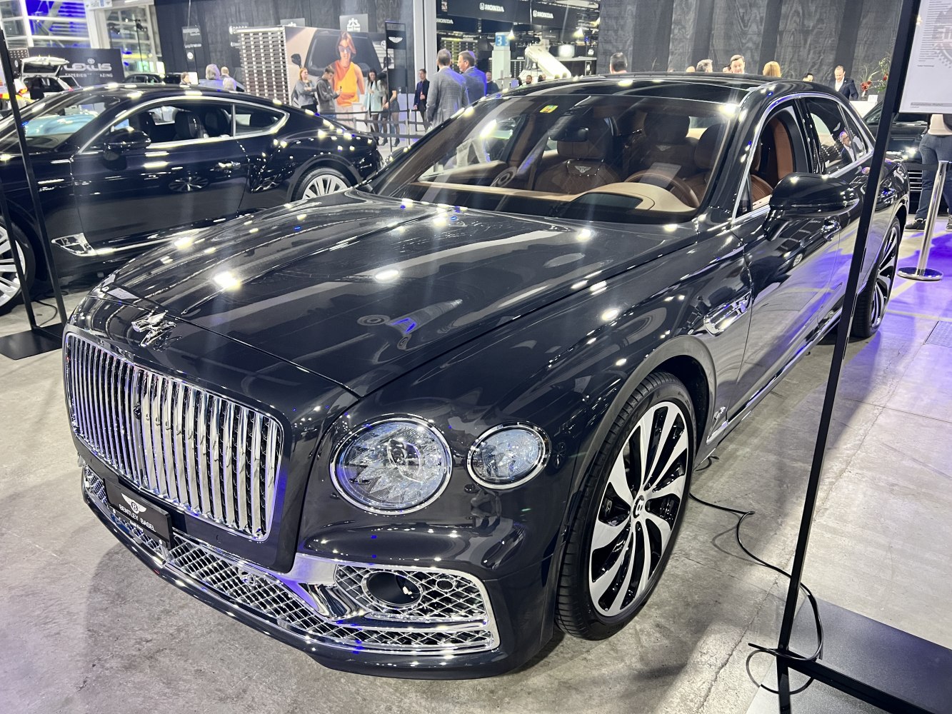 Chrome grille and dual round headlights on luxury sedan
