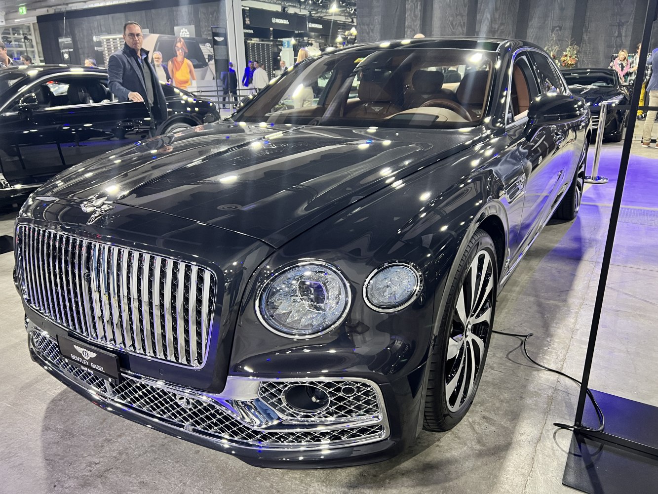 Vertical chrome grille and LED dual round headlights on luxury sedan