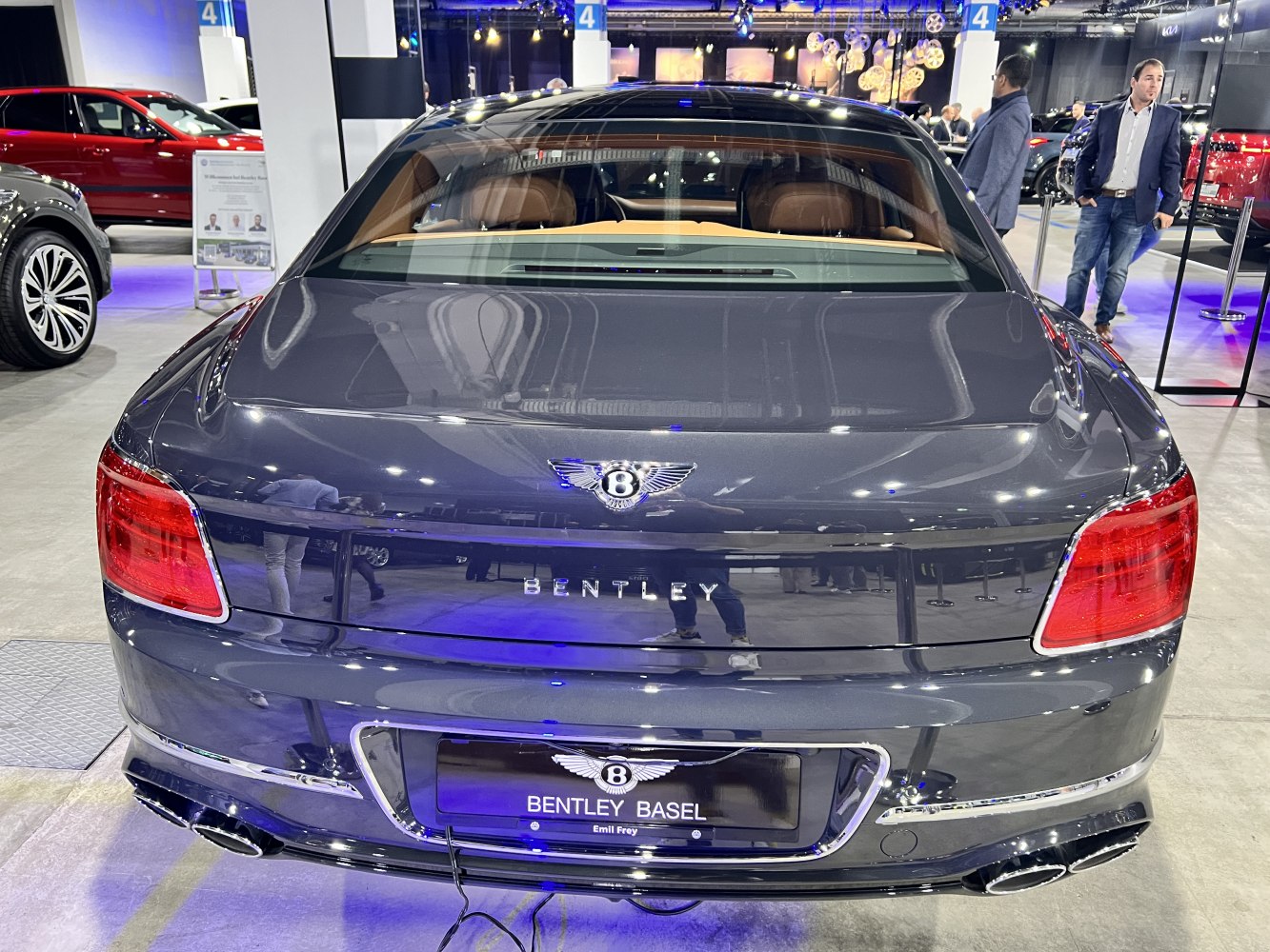 Luxury sedan rear view with distinct taillights and dual exhausts