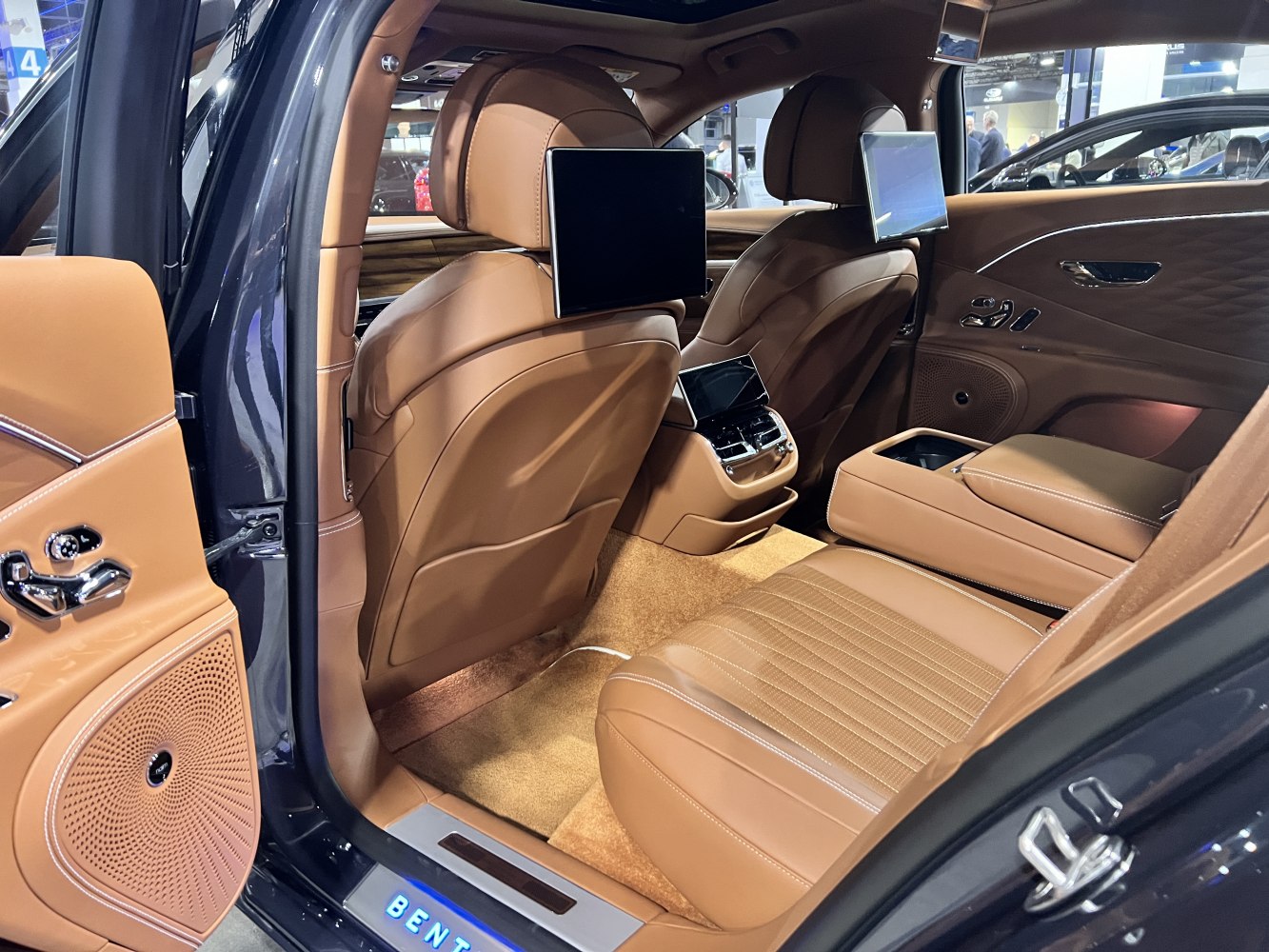 Luxury rear interior with leather seats and dual rear entertainment screens