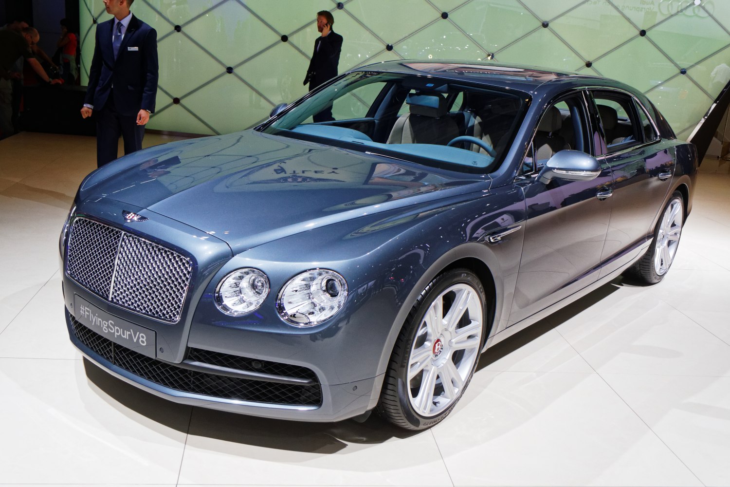 Front three-quarter view of a luxury sedan with round headlights and large grille