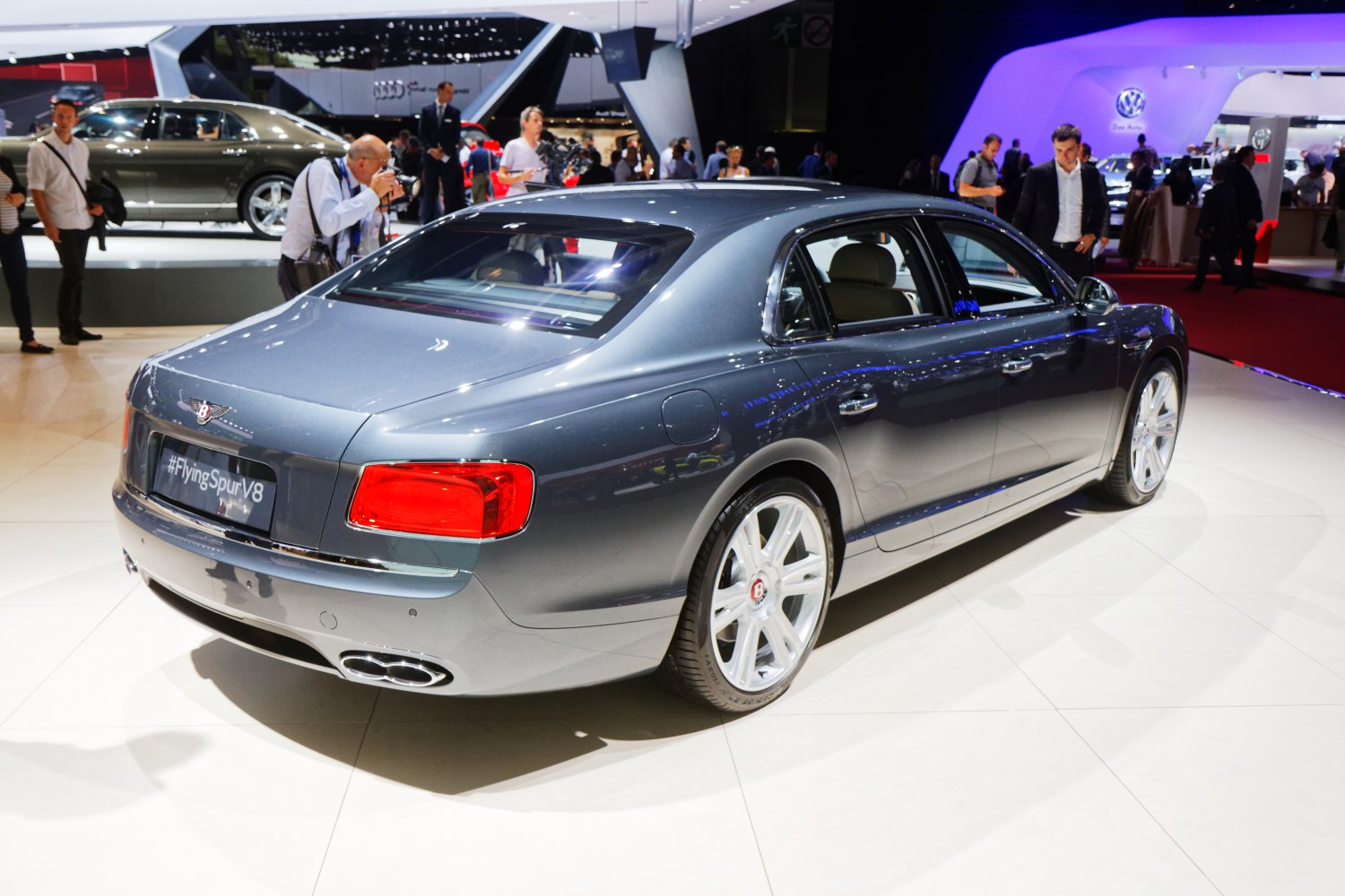 Rear and side view of luxury sedan with distinctive tail lights and sleek body design