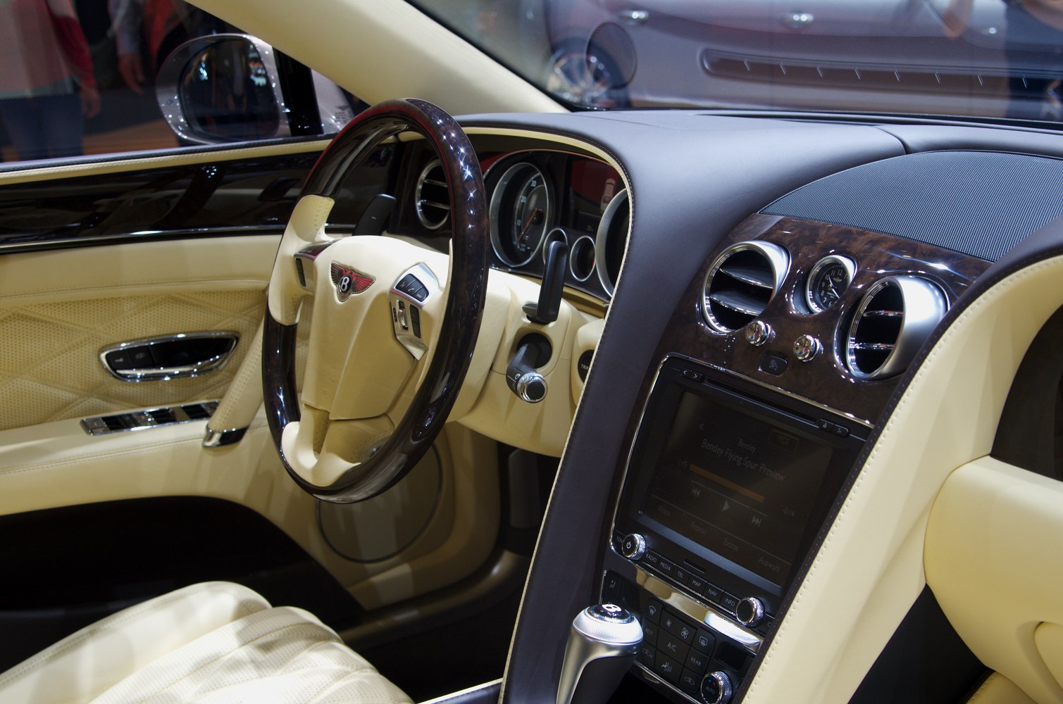 Luxury steering wheel and wood-trimmed dashboard interior