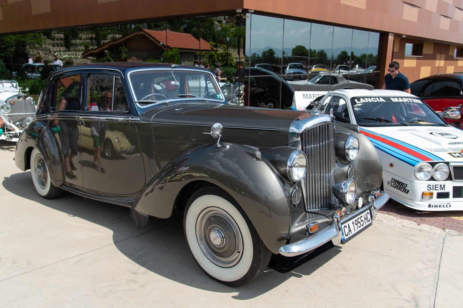 1940s luxury sedan with round headlights and whitewall tires