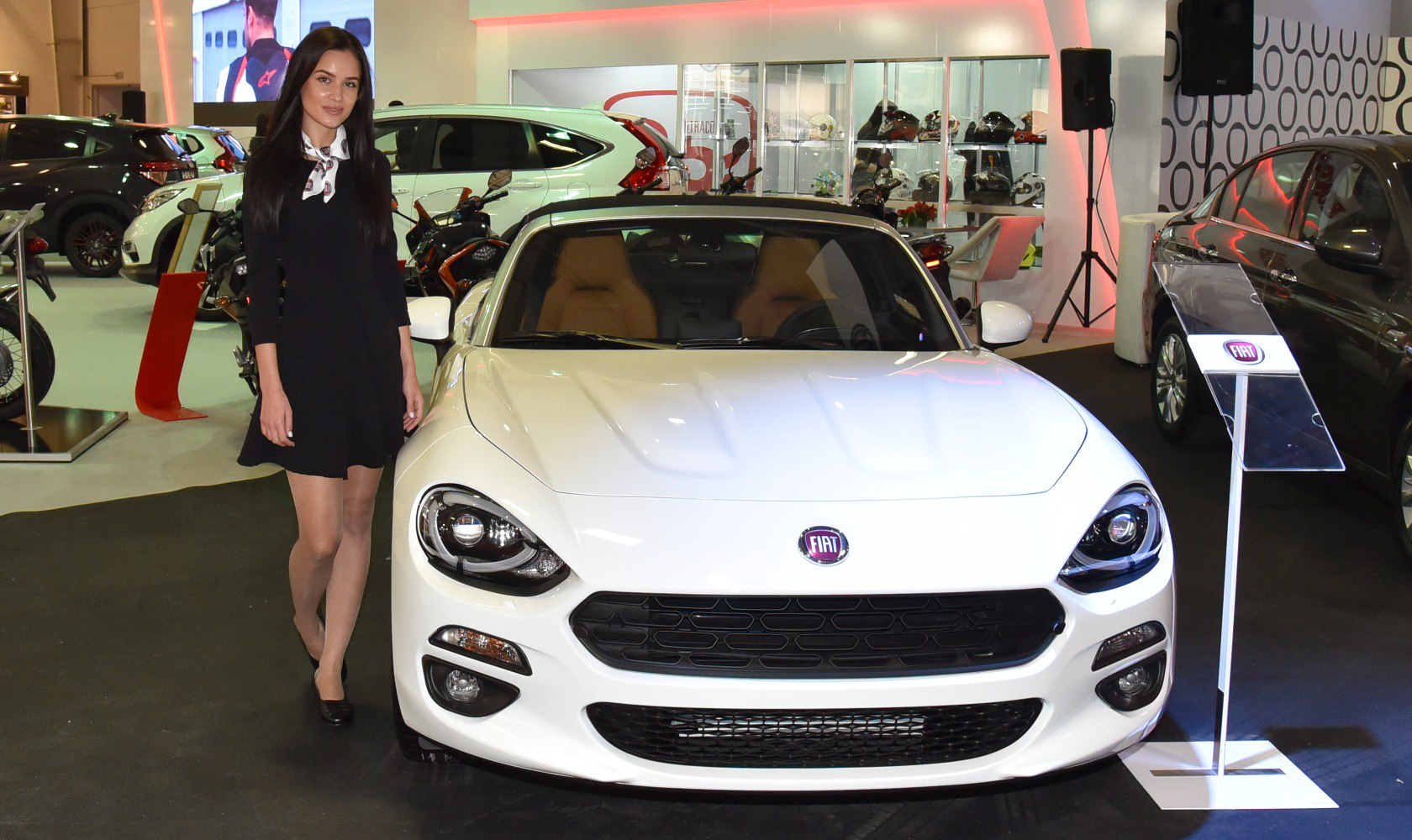 Front view with distinctive grille and headlights of a sporty convertible.
