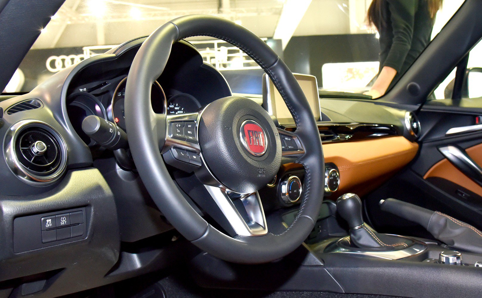 Steering wheel, dashboard, and center console of a modern roadster