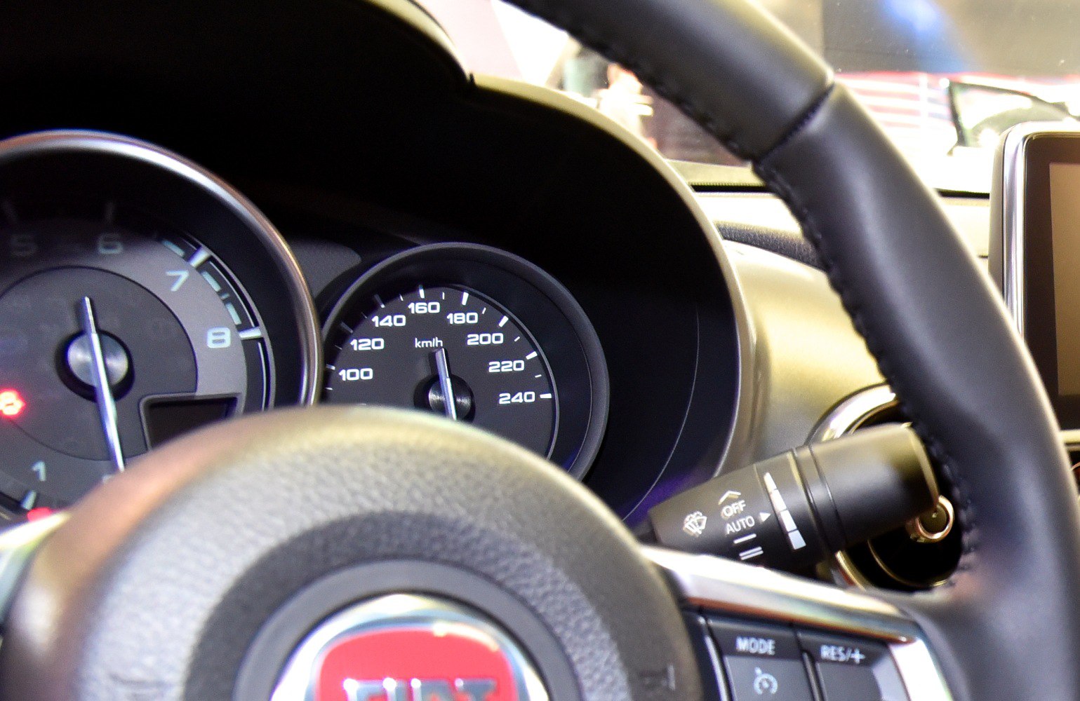 Close-up of instrument cluster and steering wheel controls