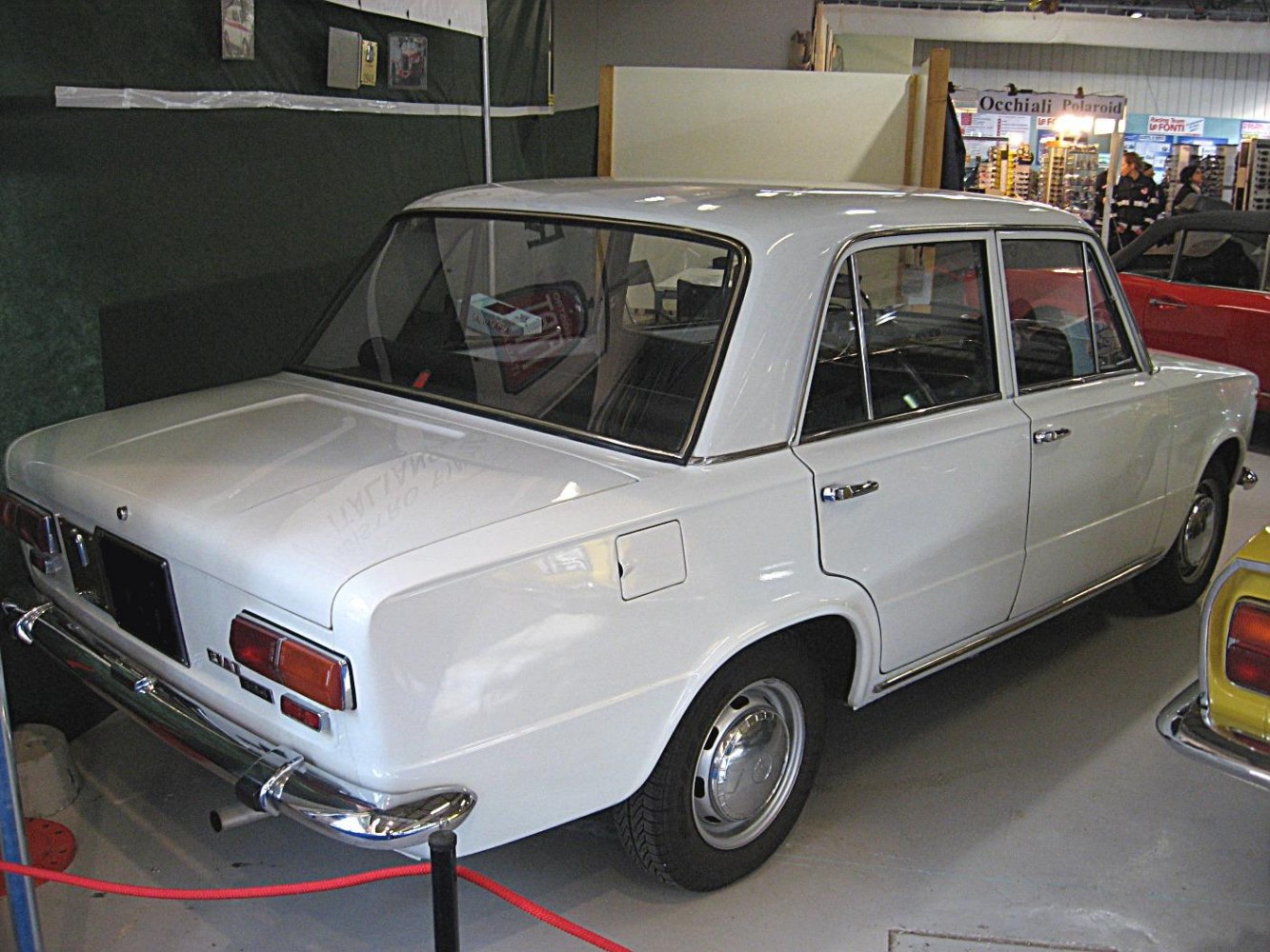 Rear side view of classic sedan with chrome bumpers and angular body lines