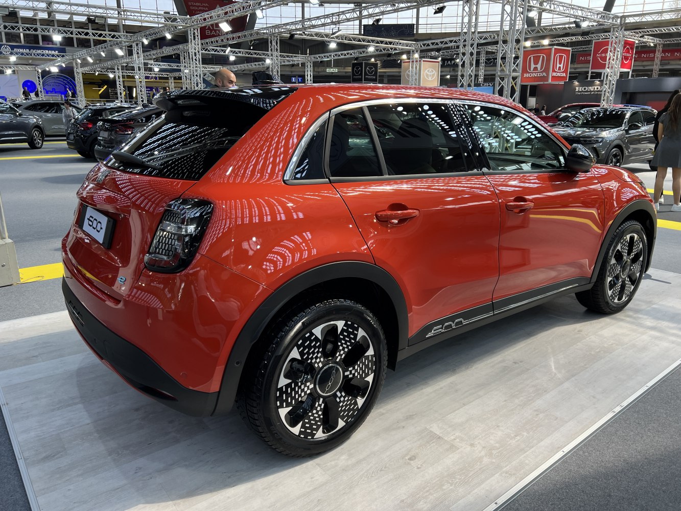 Rear-side view with unique alloy wheels and hatchback design