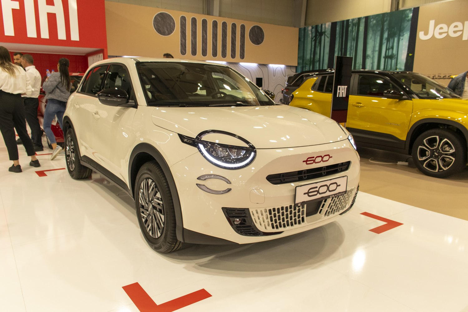 Front view of a modern compact hatchback with LED headlights and aerodynamic design.