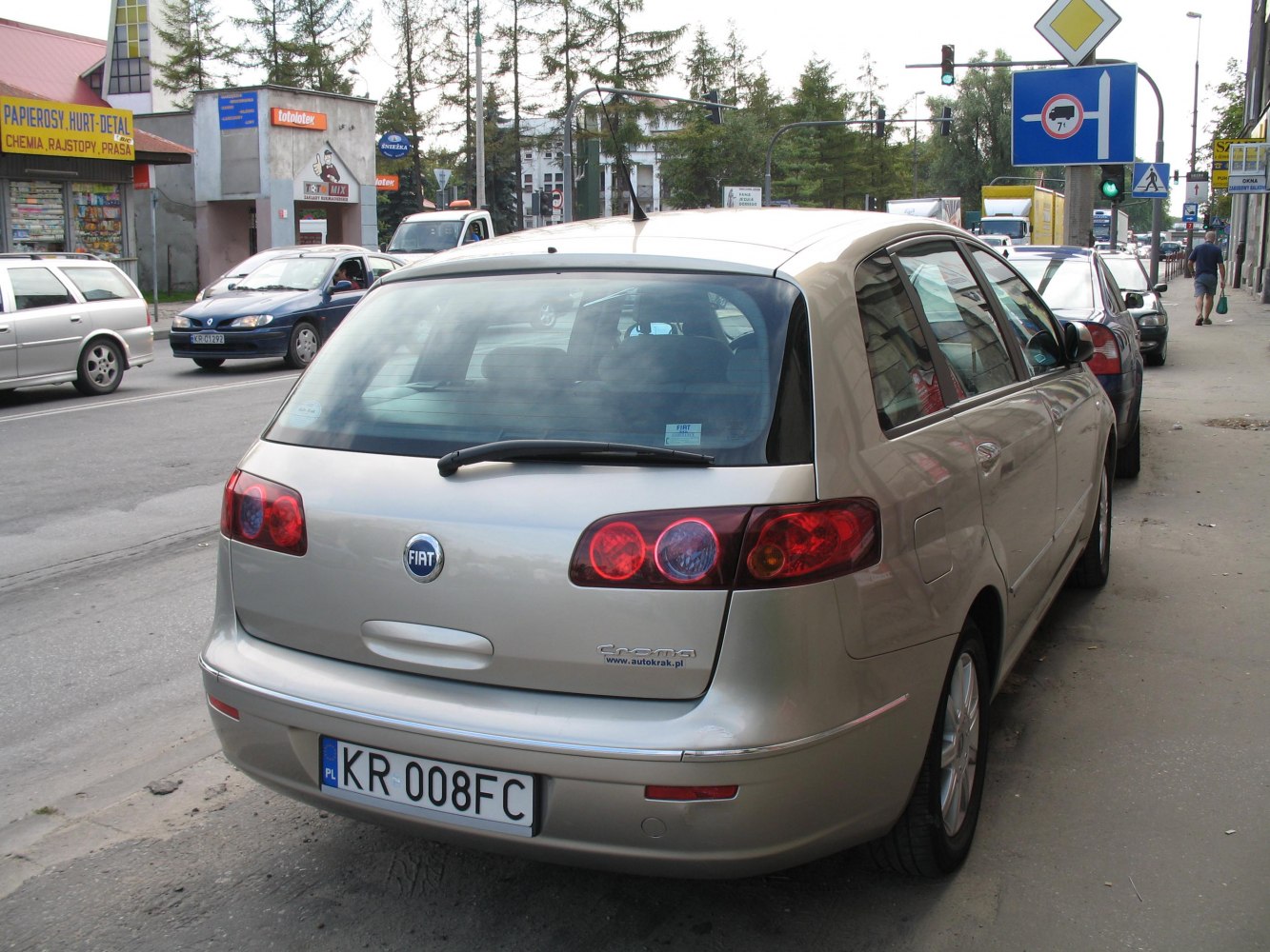 Rear view of hatchback with distinctive taillights and rear windshield wiper
