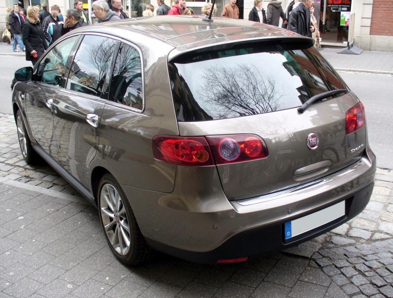 Rear view of hatchback with distinctive taillights and rear windshield wiper