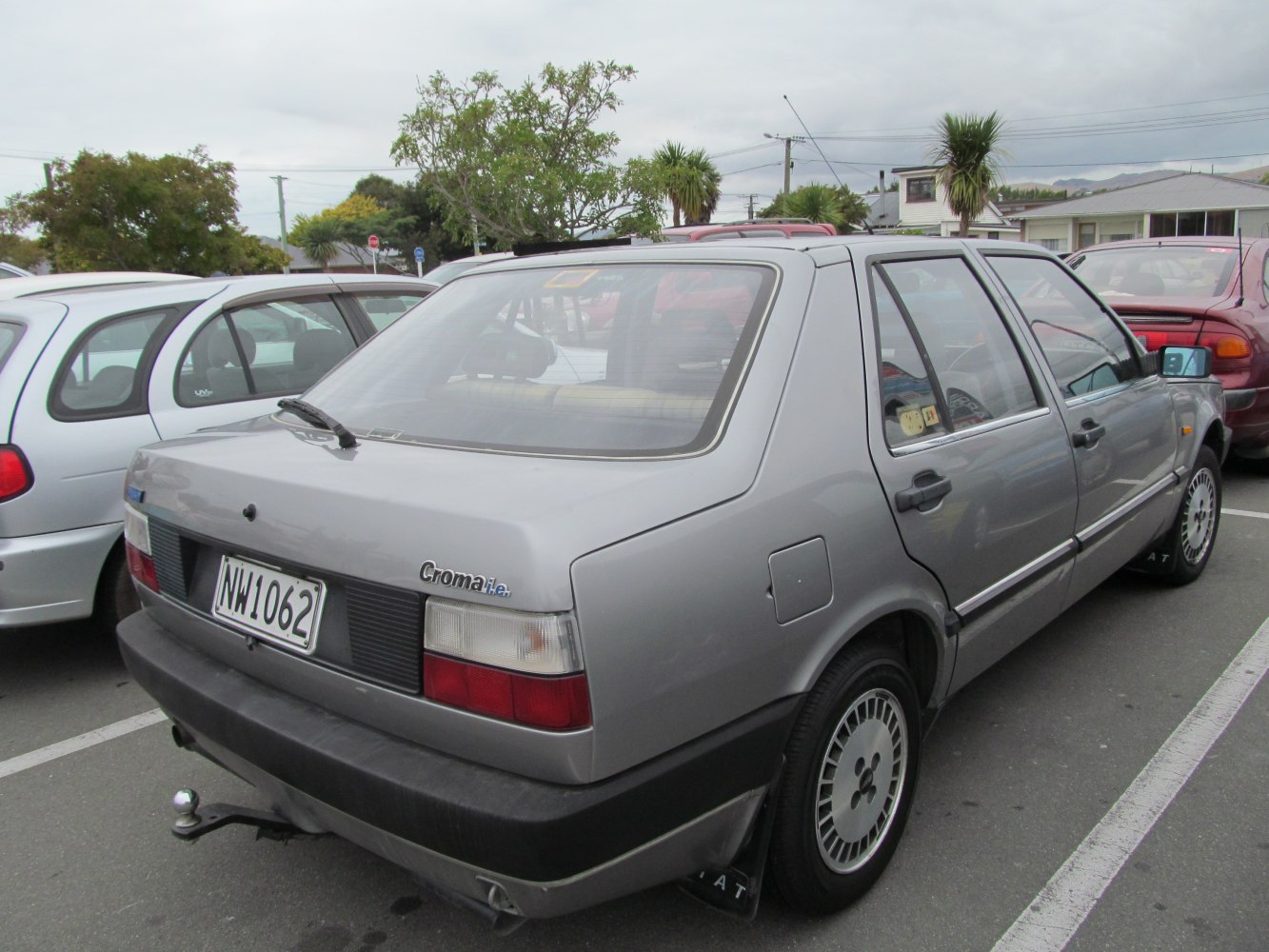 Rear view of a boxy hatchback with rear wiper and tow hitch