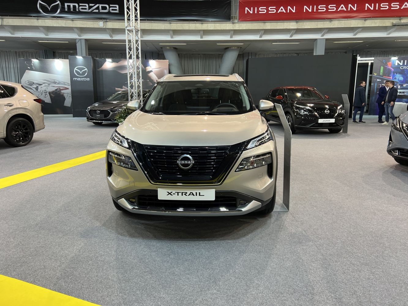 Front view of SUV with bold black grille and split headlights