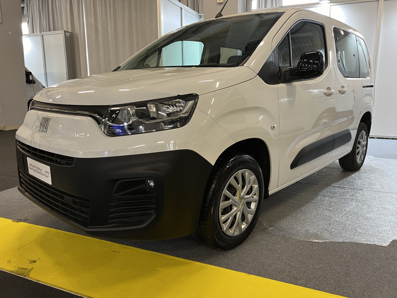 Front side view with sleek headlights and robust black bumper