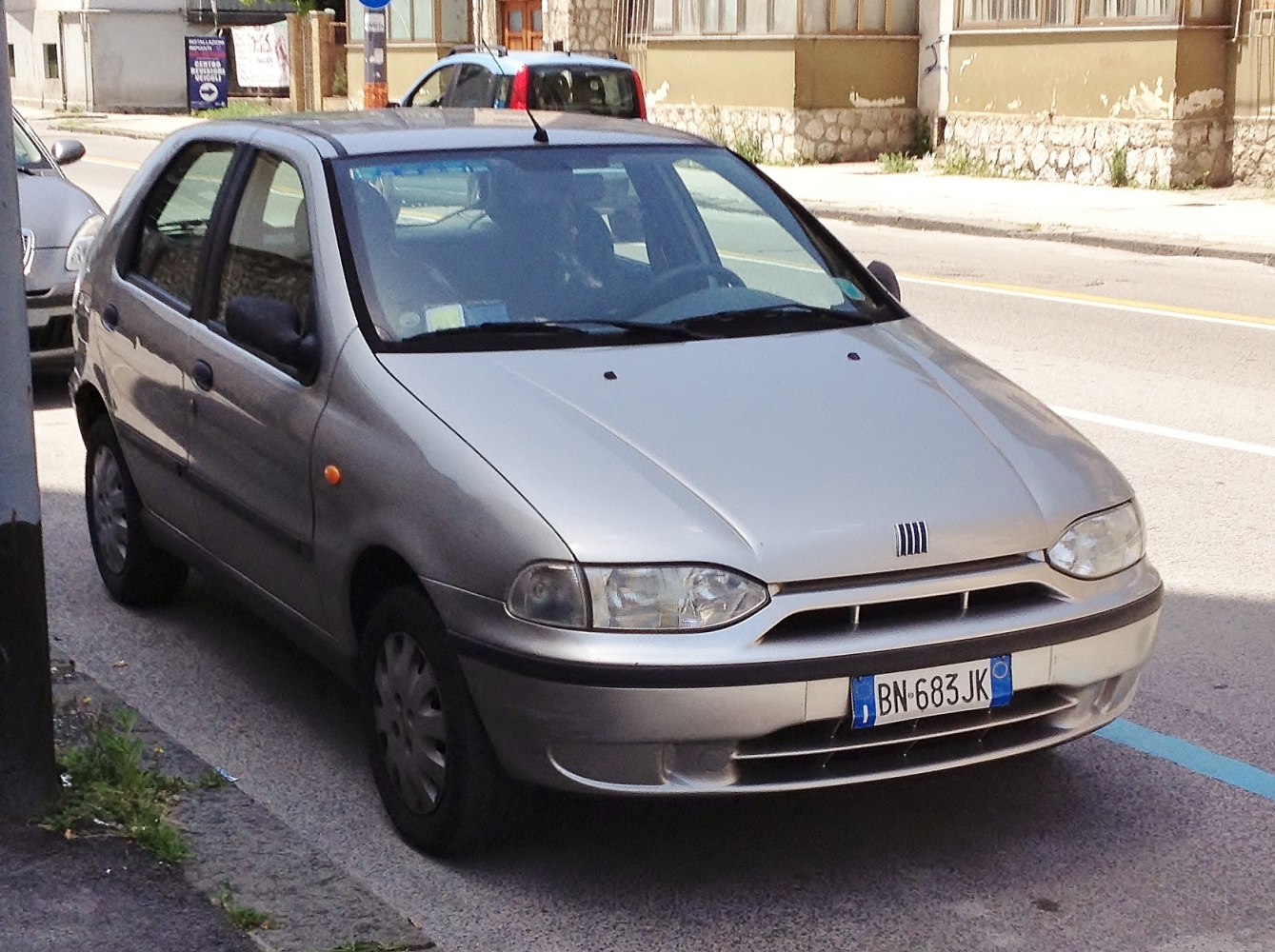 Silver hatchback with compact front design and rounded headlights