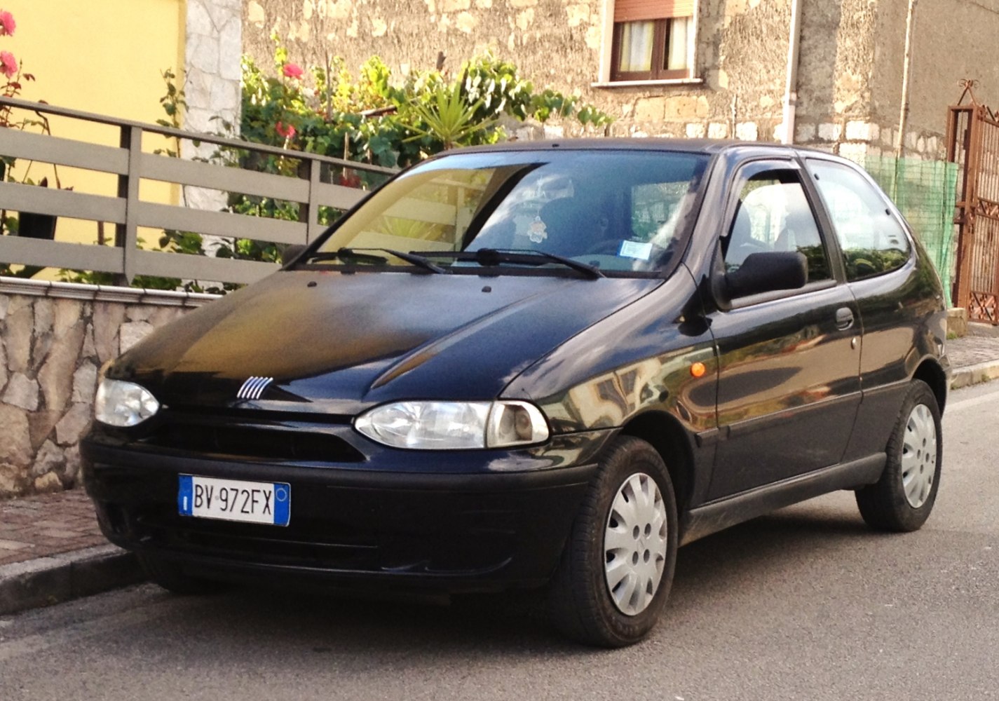 Compact hatchback with rounded headlights and smooth body lines