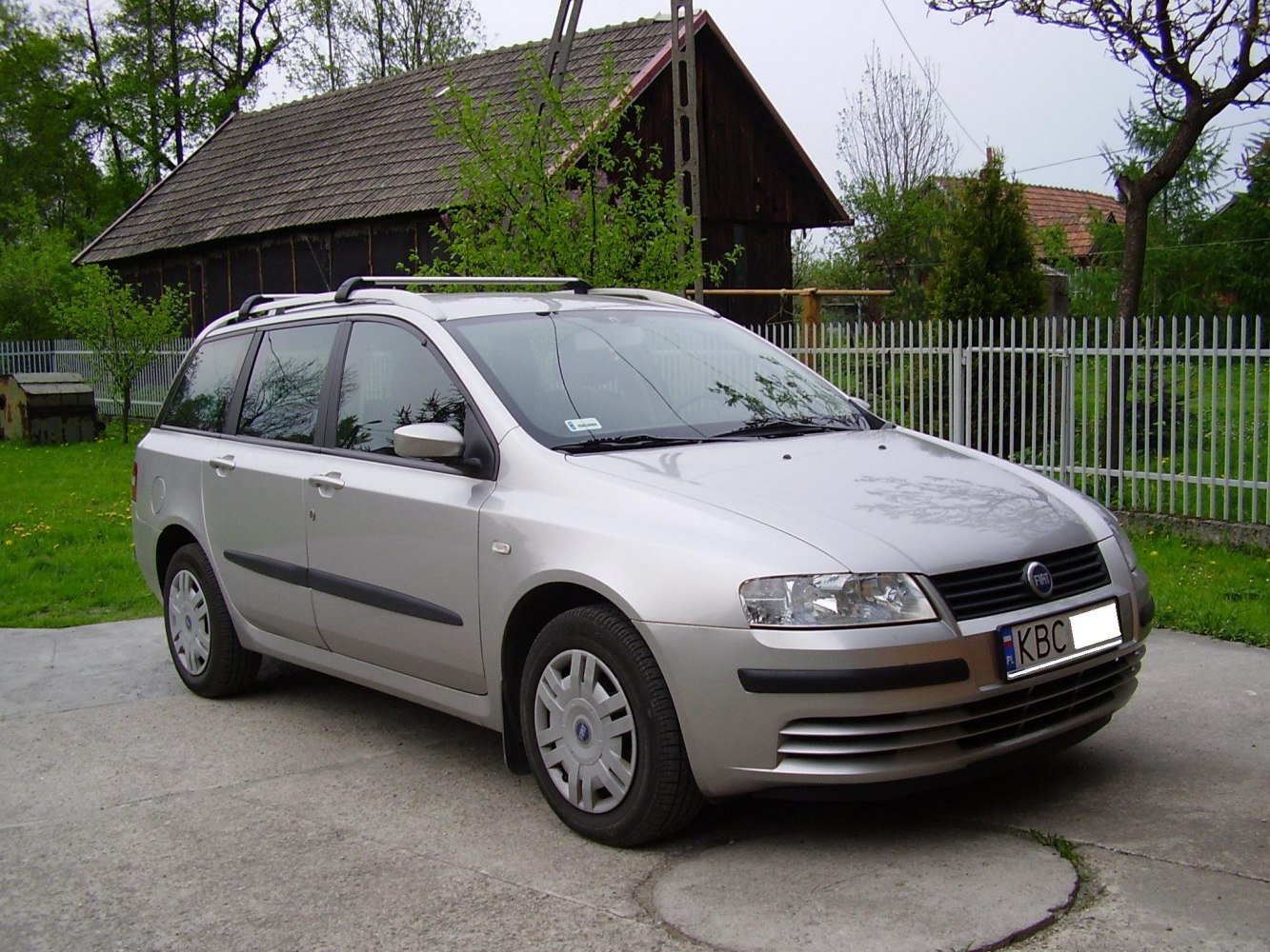 Station wagon front view with roof rails and compact design