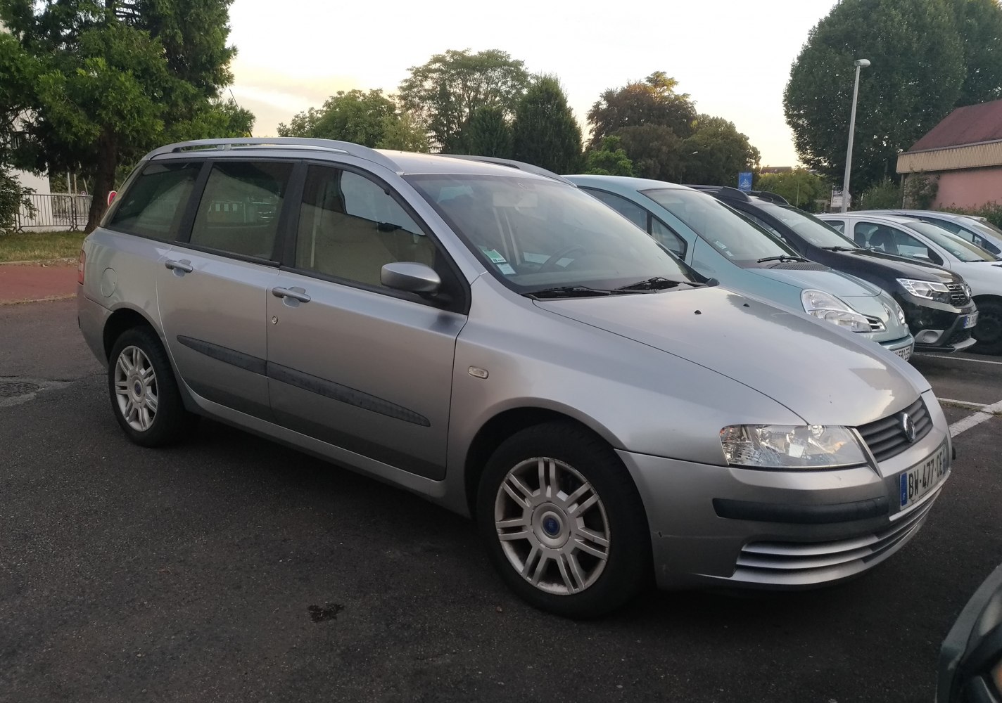 Silver station wagon with roof rails and alloy wheels