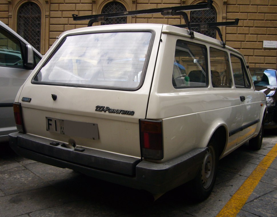Rear view of station wagon with large rear window and roof rack