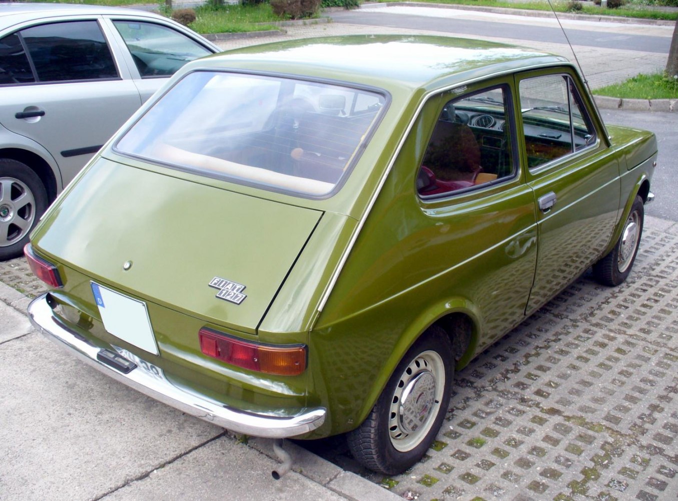 Classic hatchback rear view with distinctive sloped rear window and chrome bumper.
