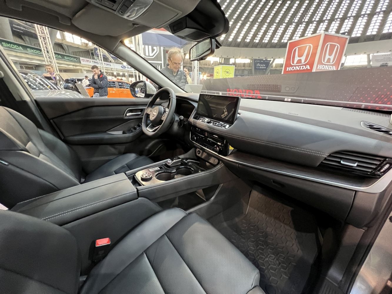 Modern car interior with digital dashboard and premium front seats