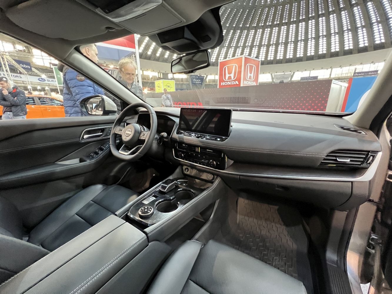 Modern car interior with digital touchscreen and steering wheel controls