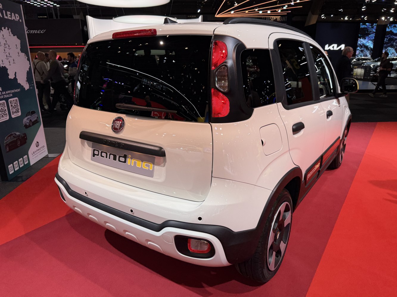Rear view of a compact car with vertical tail lights and black trim accents.