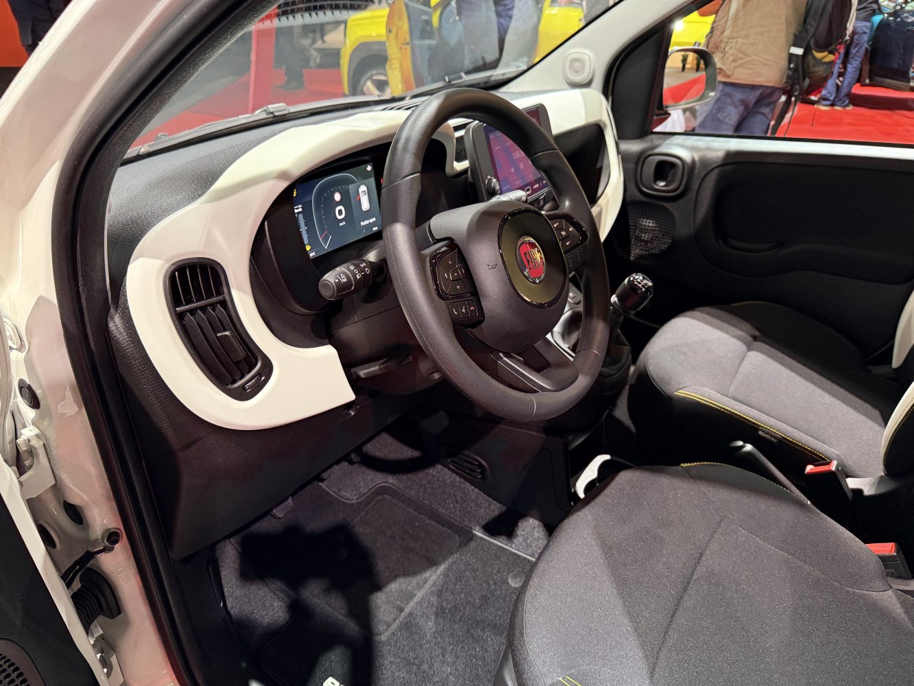 Digital instrument cluster and multifunction steering wheel in car interior