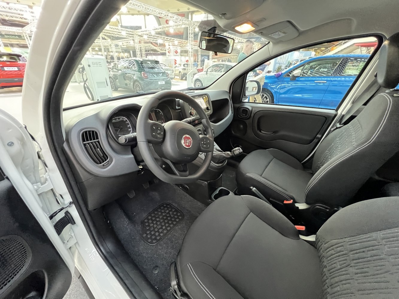 Dashboard, steering wheel, front seats, and interior layout