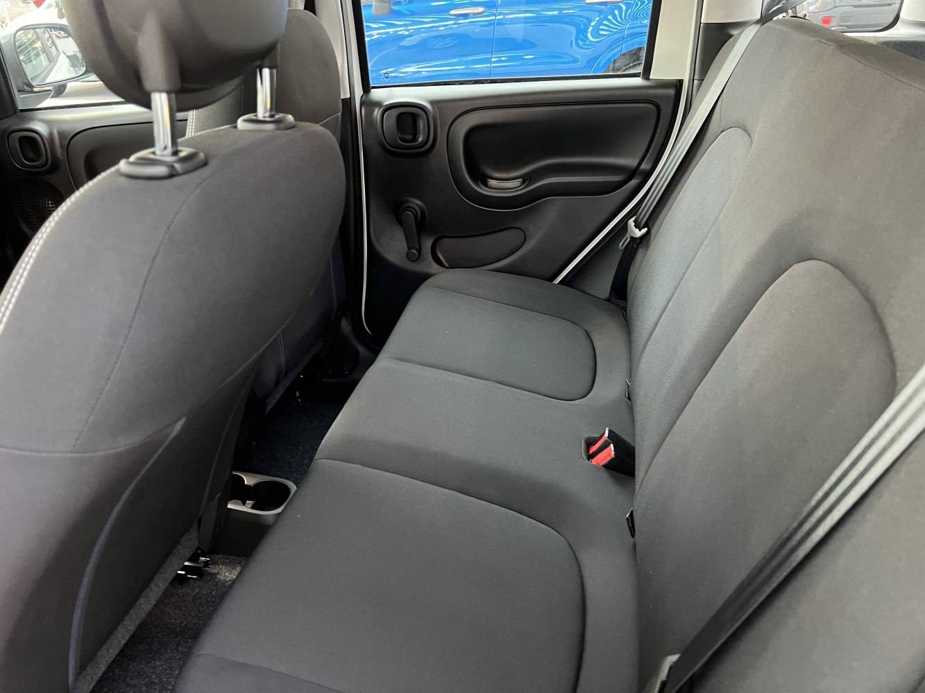 Compact rear seat and door panel of a small hatchback
