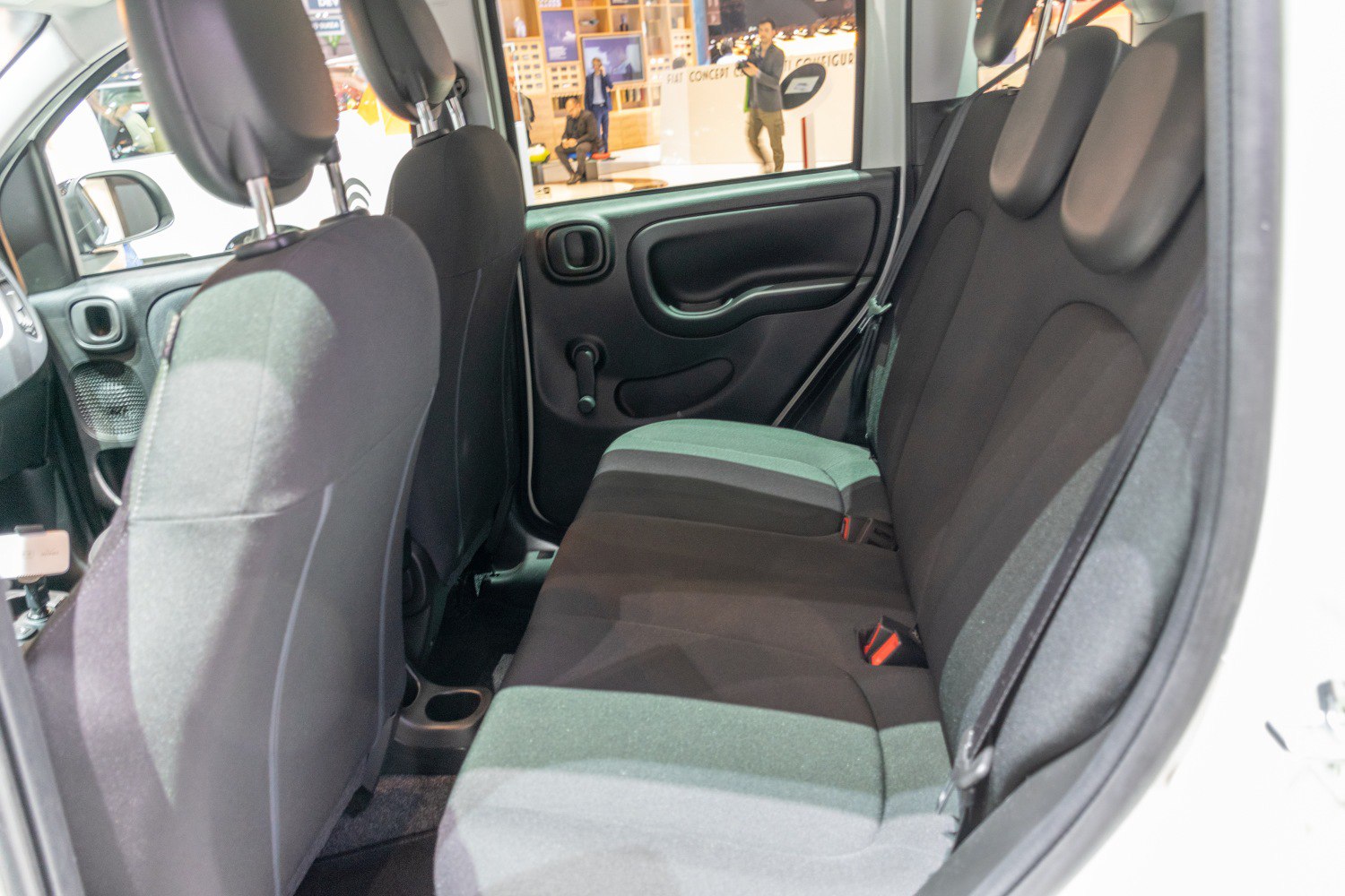 Rear seat interior with fabric upholstery and manual window crank