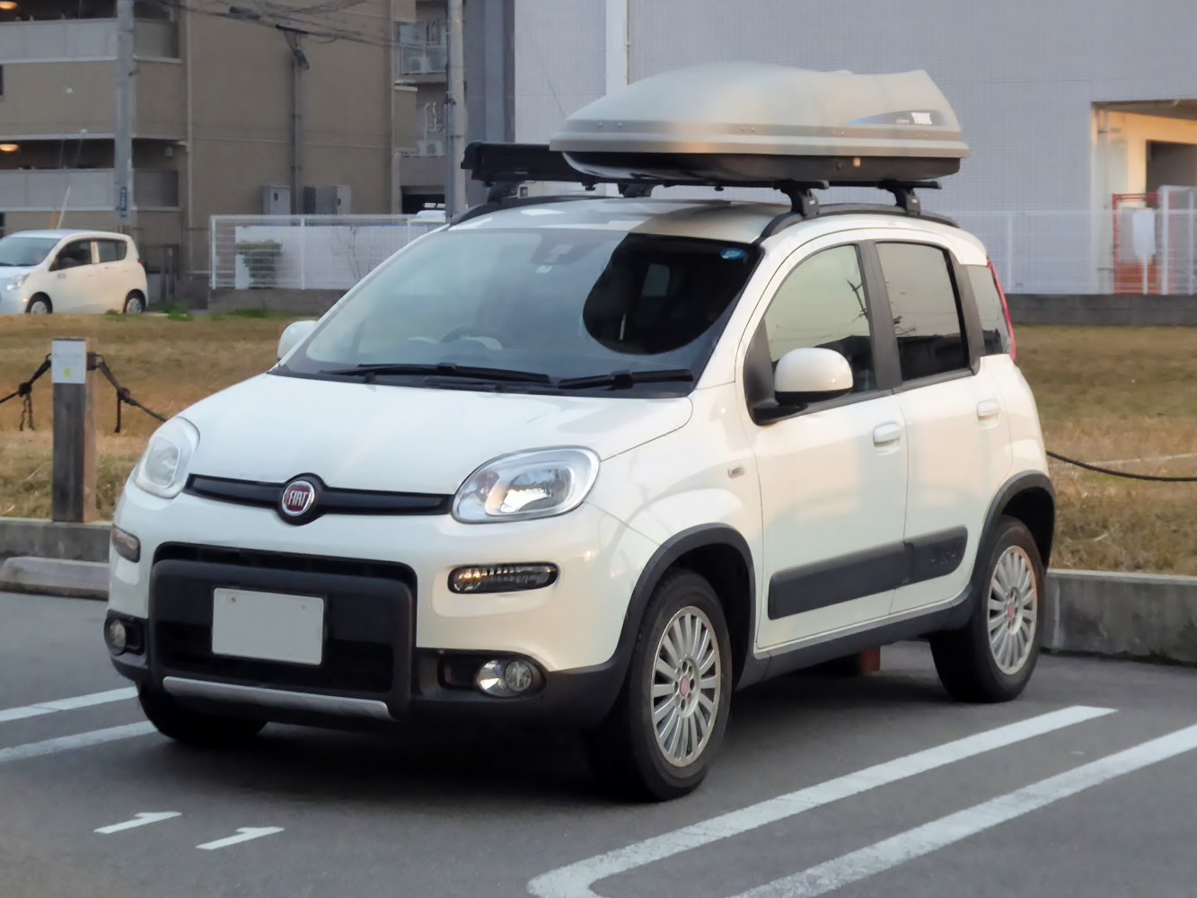 Compact 4x4 SUV with roof cargo box