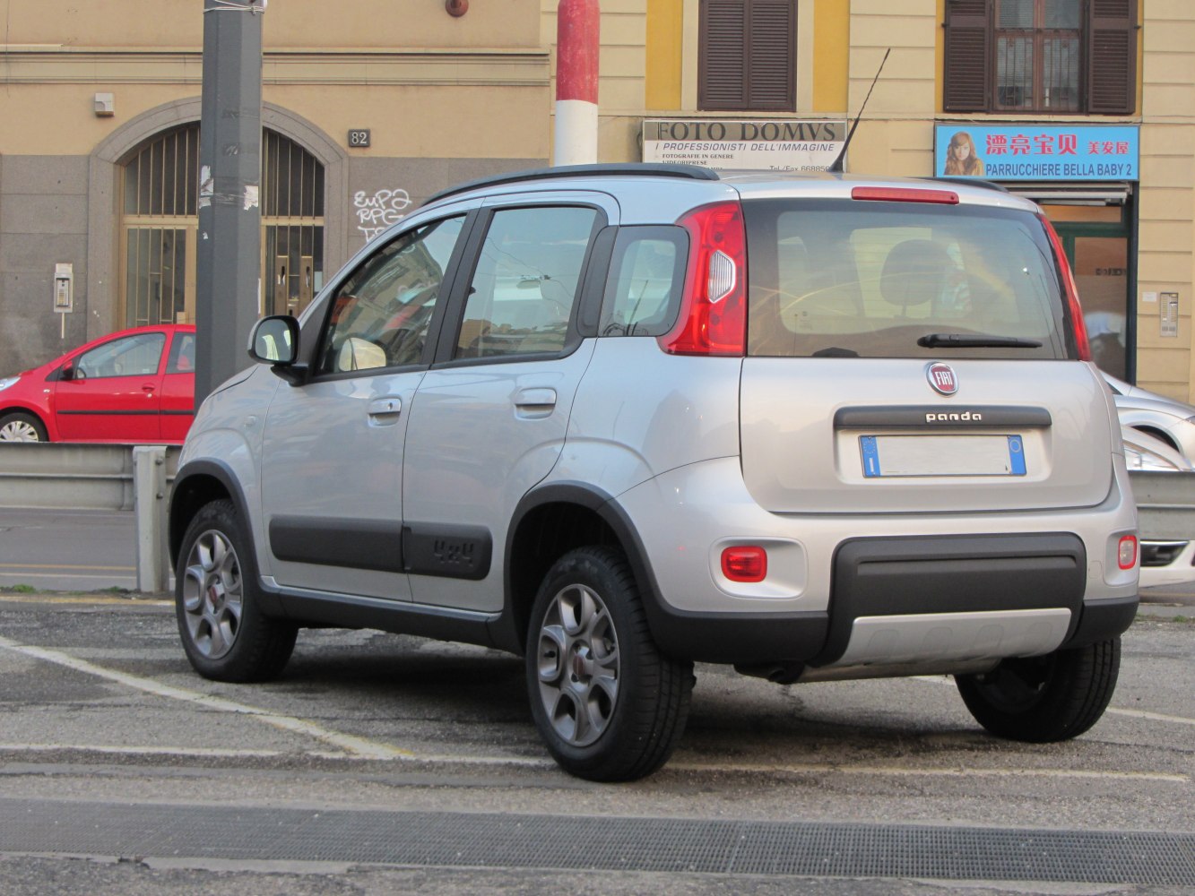 Rear side view of compact rugged SUV with 4x4 badge and five doors