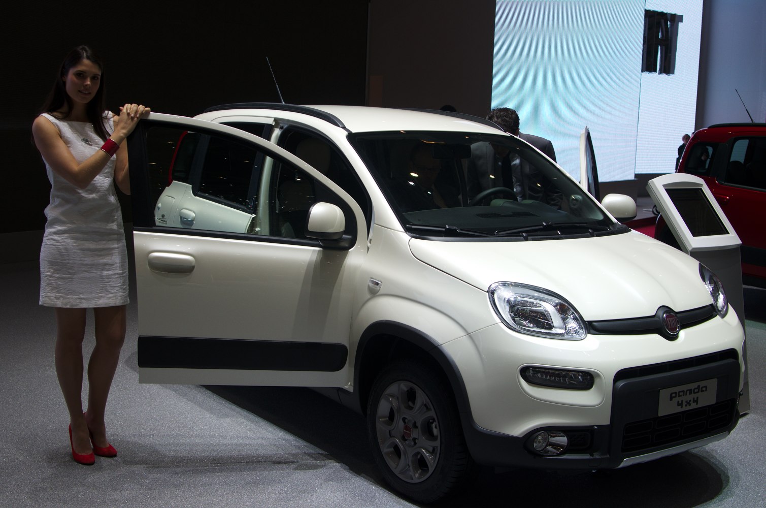 Front side view with open driver door of compact SUV