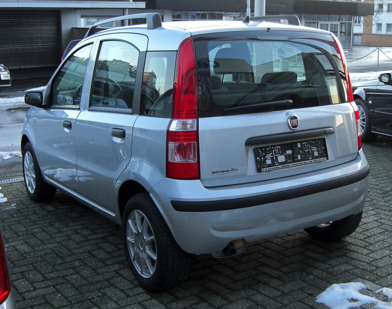 Rear view of compact hatchback with tall vertical taillights