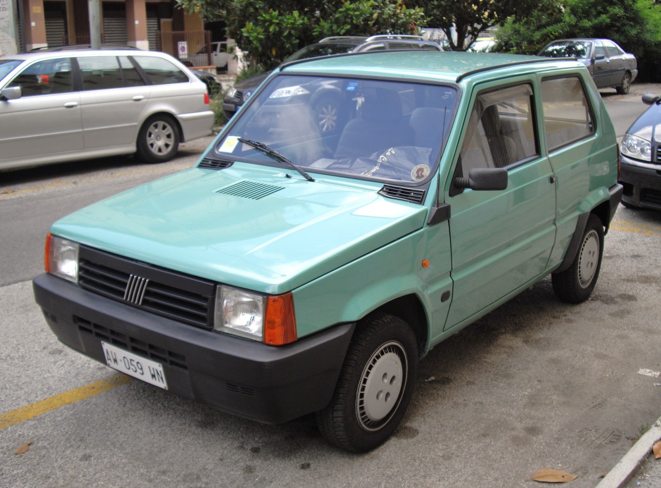 Compact hatchback with rectangular headlights and black grille