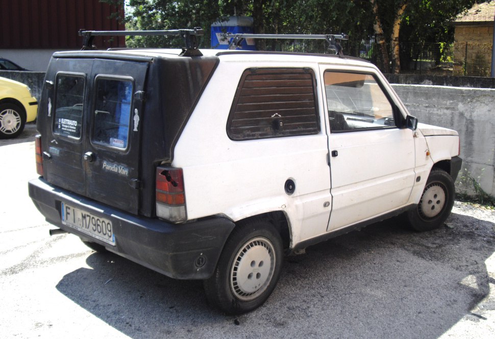 Rear cargo doors and compact boxy van body with a roof rack