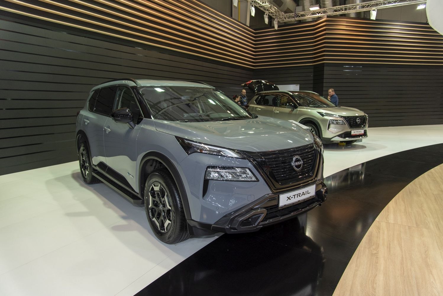 Front and side exterior view of a modern SUV in showroom
