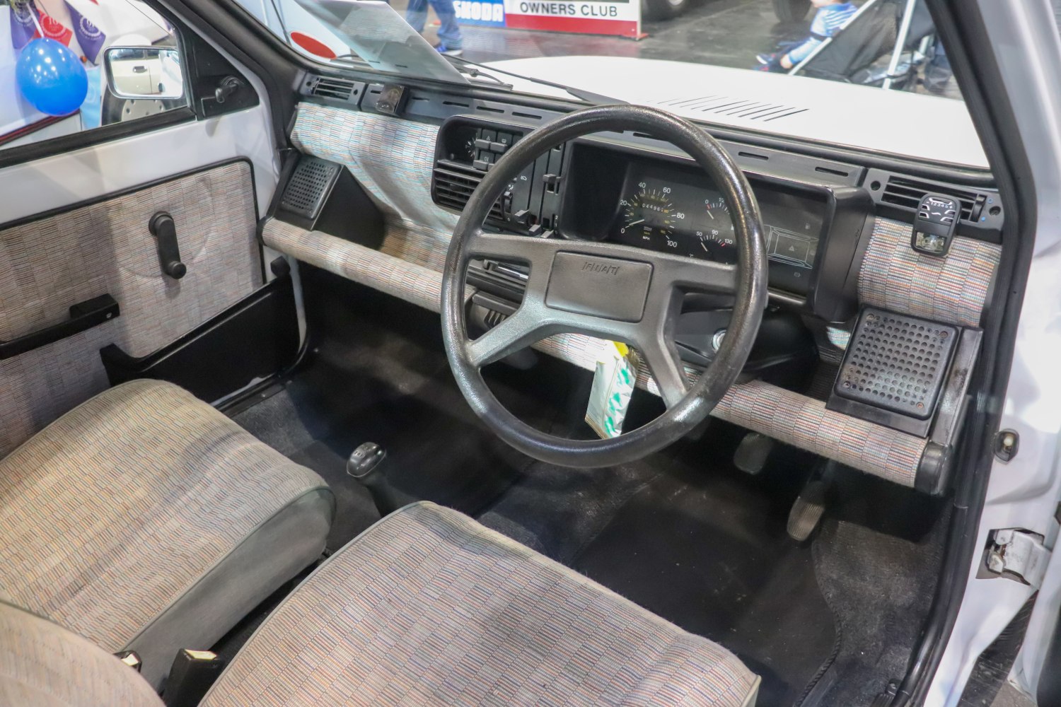 Vintage car interior with classic dashboard and steering wheel